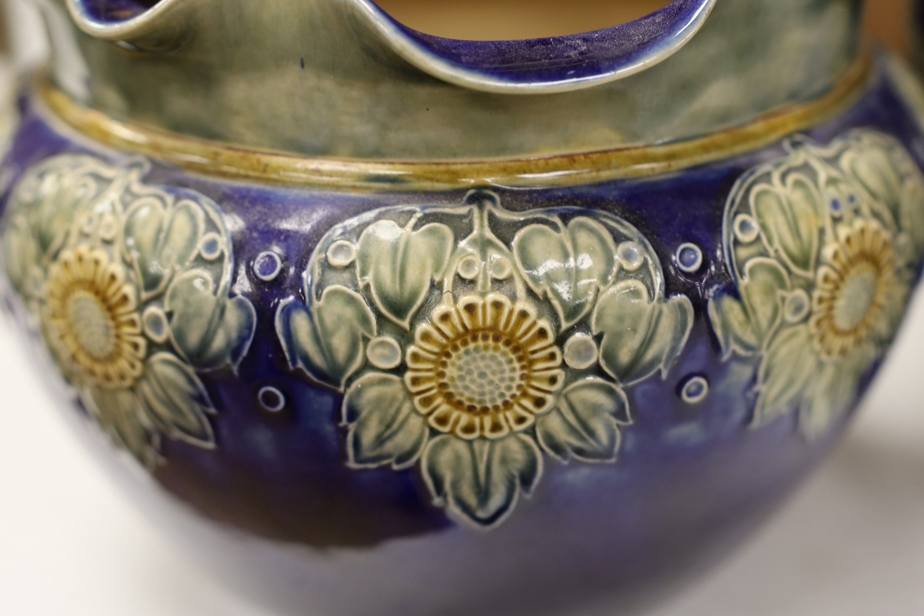 A Royal Doulton blue stoneware jardiniere by Hannah Barlow and another smaller jardiniere by Maude Bowden, largest 29cm in diameter (2). Condition - good